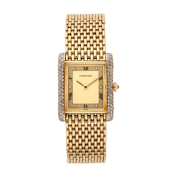 CARTIER - CARTIER - TANK OROLOGIO A CARICA MANUALE IN ORO GIALLO 18KT CON BRILLANTI E BRACCIALE IN ORO.