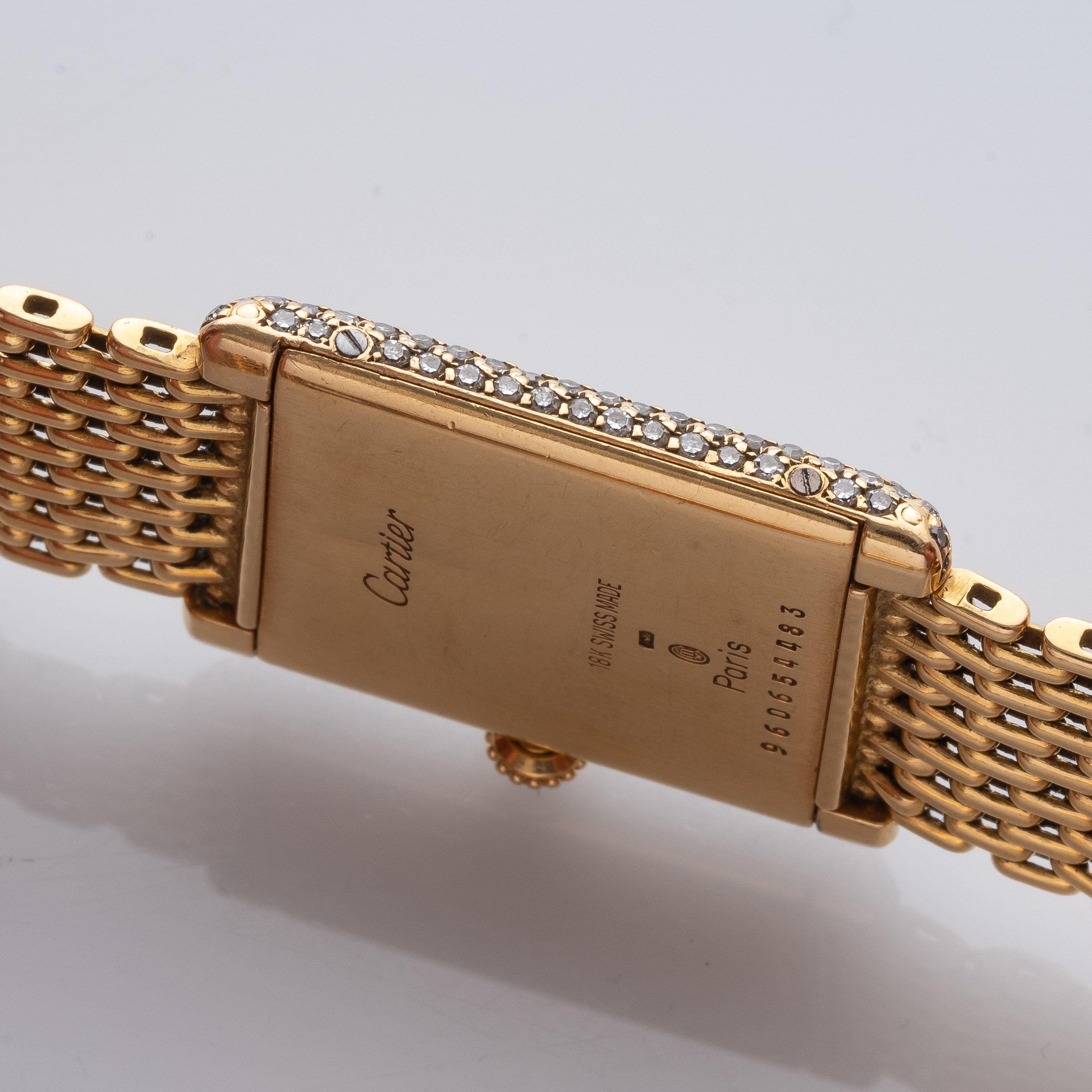 CARTIER - TANKOROLOGIO A CARICA MANUALE IN ORO GIALLO 18KT CON BRILLANTI E BRACCIALE IN ORO.