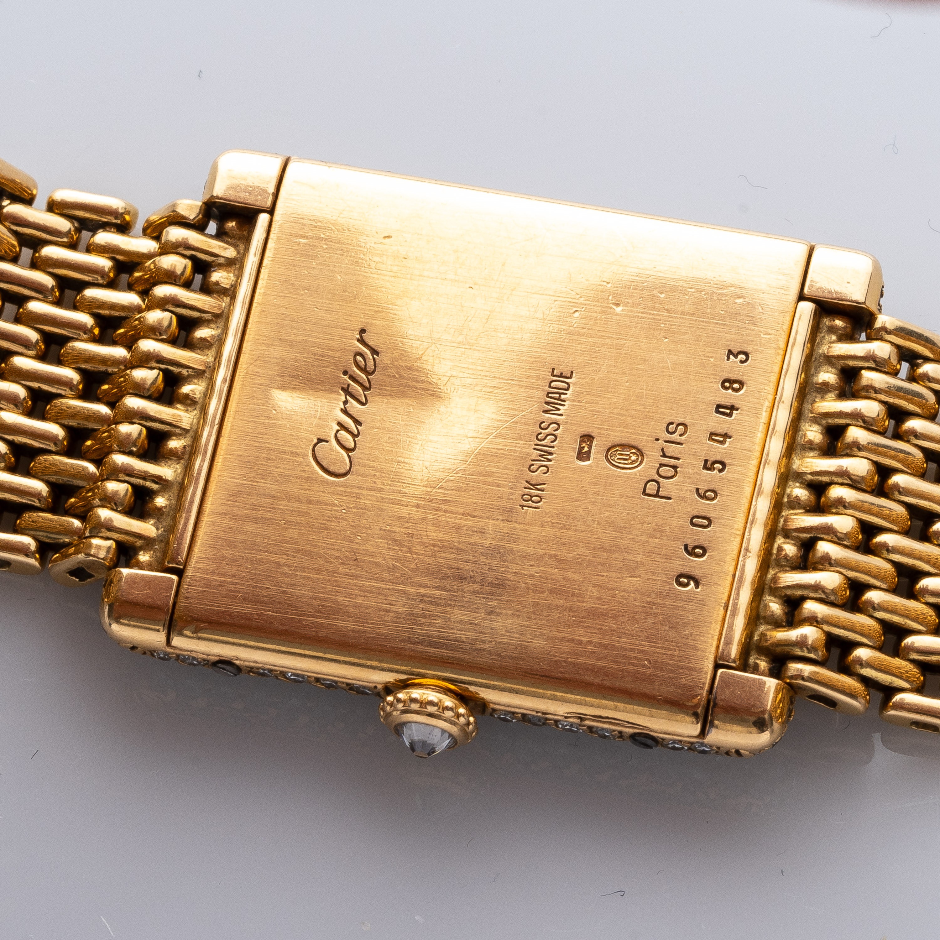 CARTIER - TANKOROLOGIO A CARICA MANUALE IN ORO GIALLO 18KT CON BRILLANTI E BRACCIALE IN ORO.