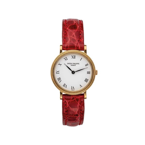 PATEK PHILIPPE - PATEK PHILIPPE - CALATRAVA OROLOGIO DA DONNA AL QUARZO IN ORO GIALLO 18KT CON CASSA TAPESTRY.