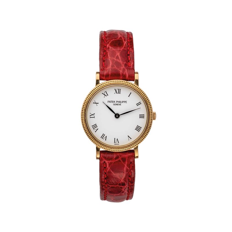 PATEK PHILIPPE - CALATRAVAOROLOGIO DA DONNA AL QUARZO IN ORO GIALLO 18KT CON CASSA TAPESTRY.