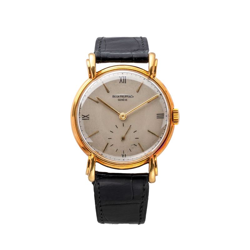 PATEK PHILIPPE - CALATRAVAOROLOGIO SOLO TEMPO A CARICA MANUALE IN ORO GIALLO 18KT CON ANSE A RAGN...