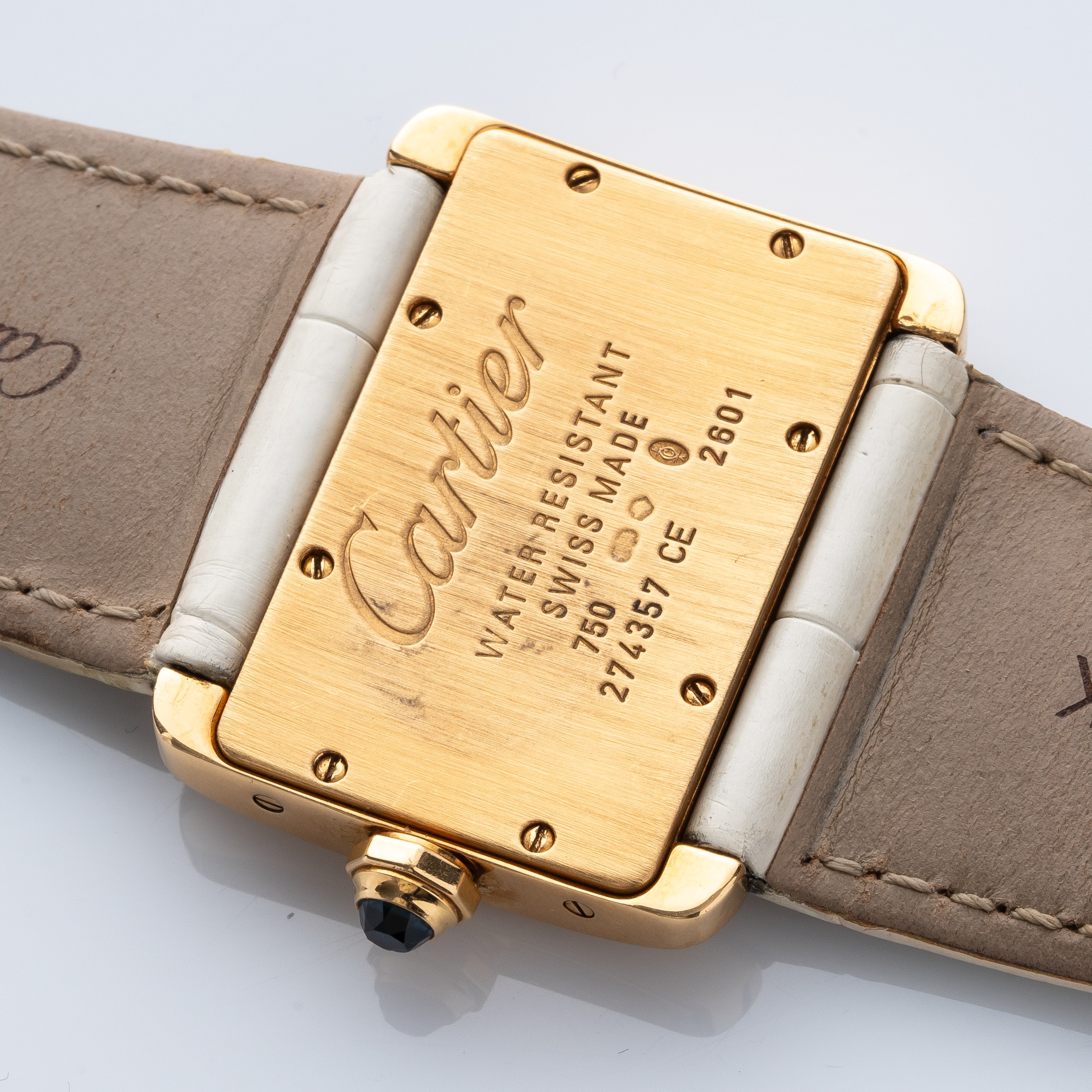 CARTIER - TANK DIVANOROLOGIO SOLO TEMPO AL QUARZO IN ORO GIALLO 18KT E CON QUADRANTE BIANCO.