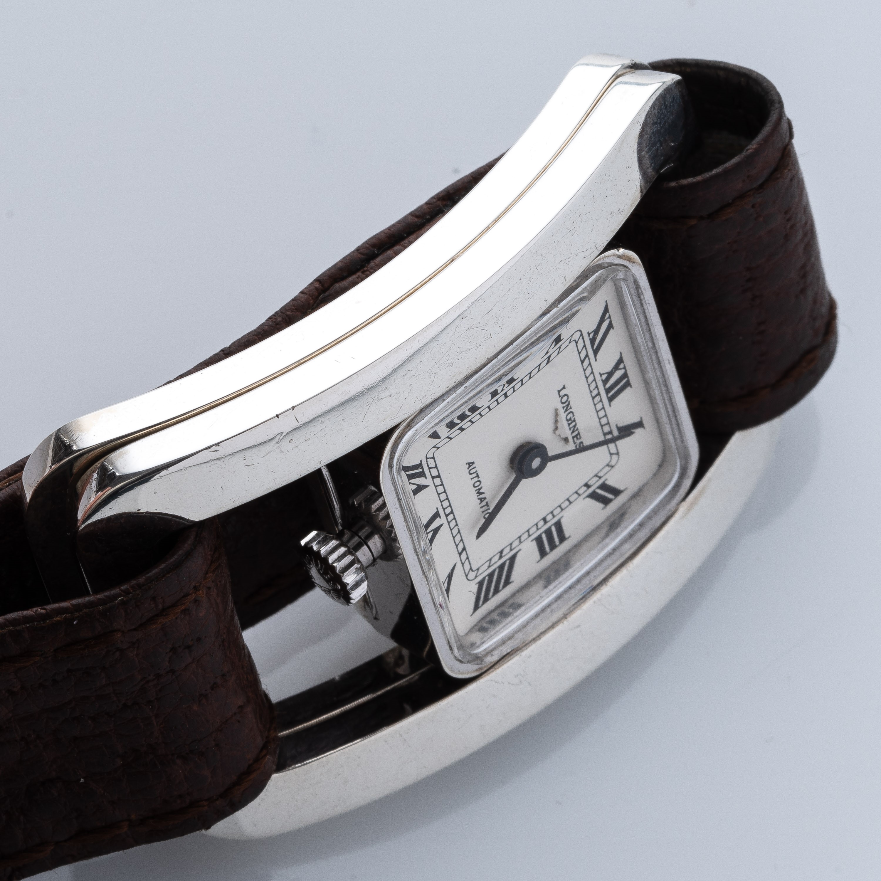 LONGINES - MANZONOROLOGIO 'FIBBIA' A CARICA AUTOMATICA IN ARGENTO CON QUADRANTE BIANCO.