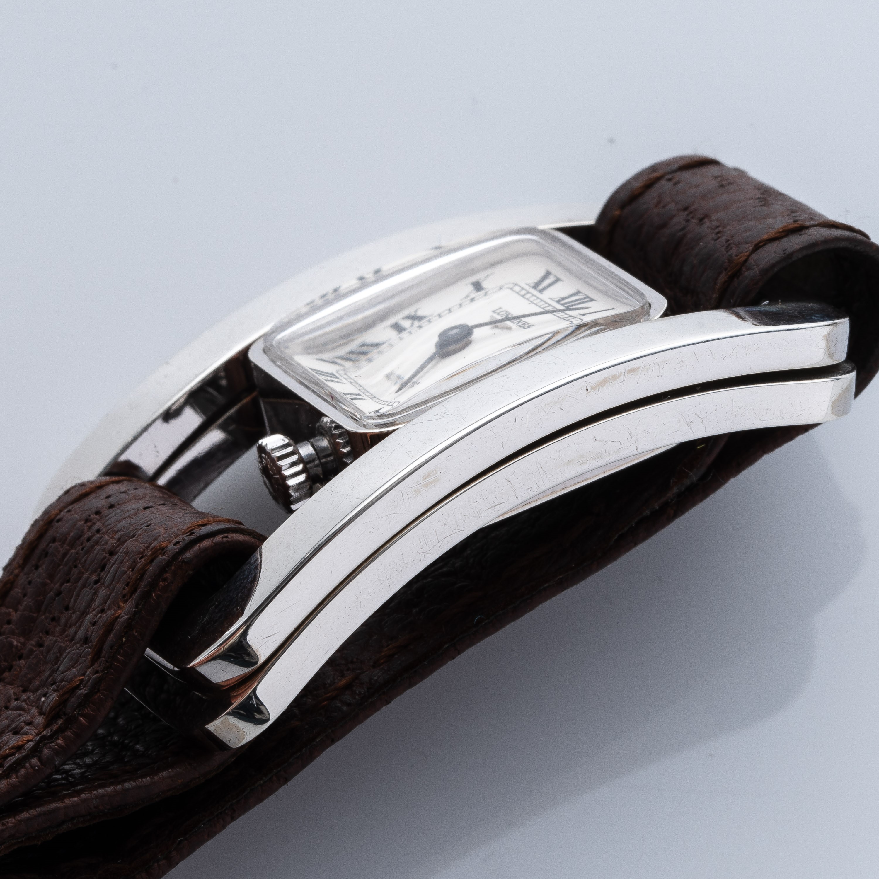 LONGINES - MANZONOROLOGIO 'FIBBIA' A CARICA AUTOMATICA IN ARGENTO CON QUADRANTE BIANCO.