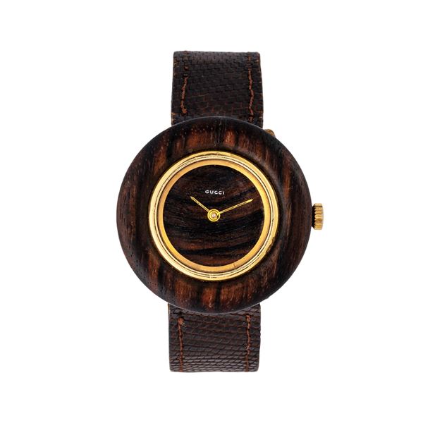 GUCCI : GUCCI - DISCO VOLANTE OROLOGIO SOLO TEMPO A CARICA MANUALE IN ORO GIALLO 18KT E RADICA  - Asta THE ONE For passionate only - Spangaro & Co Aste