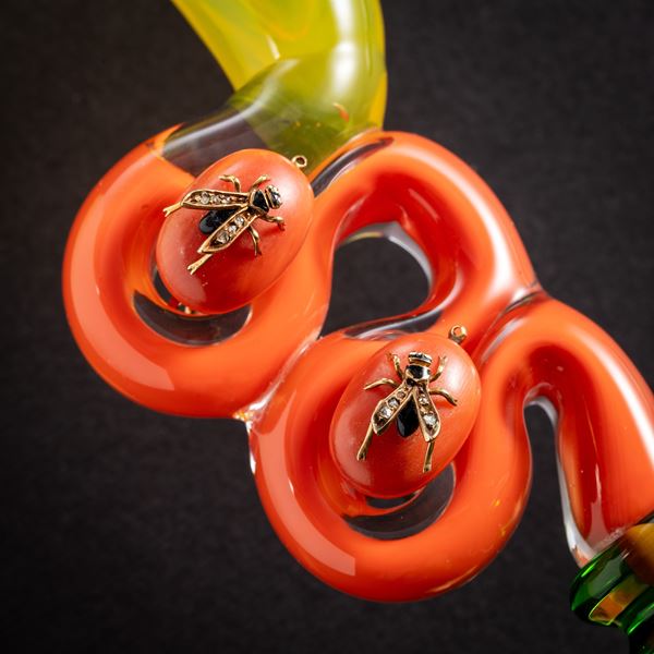 18 KT YELLOW GOLD AND DIAMOND 'BEE' EARRINGS RESTING ON TWO SPOOLS OF CONFETTI CORAL