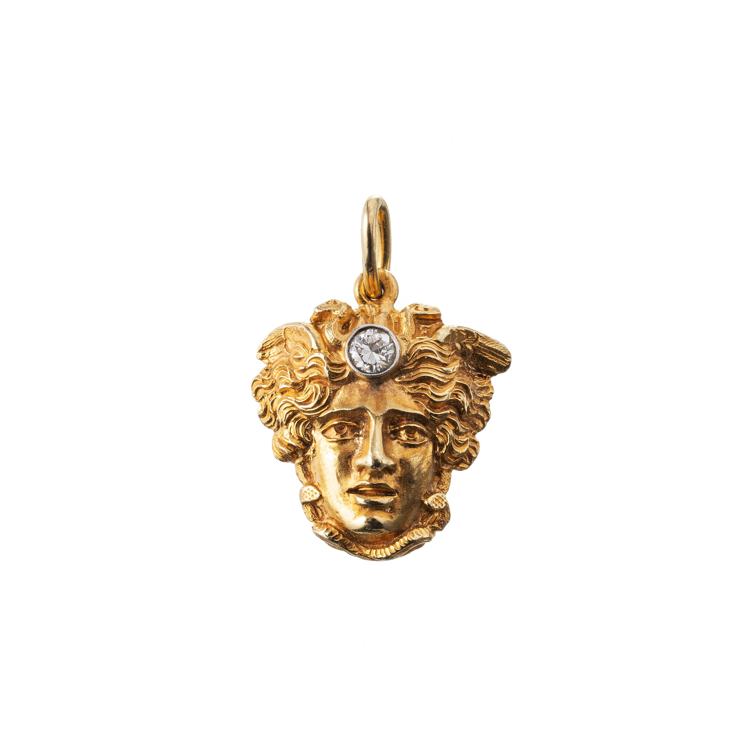 CIONDOLO IN ORO GIALLO 18 KT CON TESTA DI MEDUSA CON INCASTONATO UN DIAMANTE DI CIRCA CT. 0.18