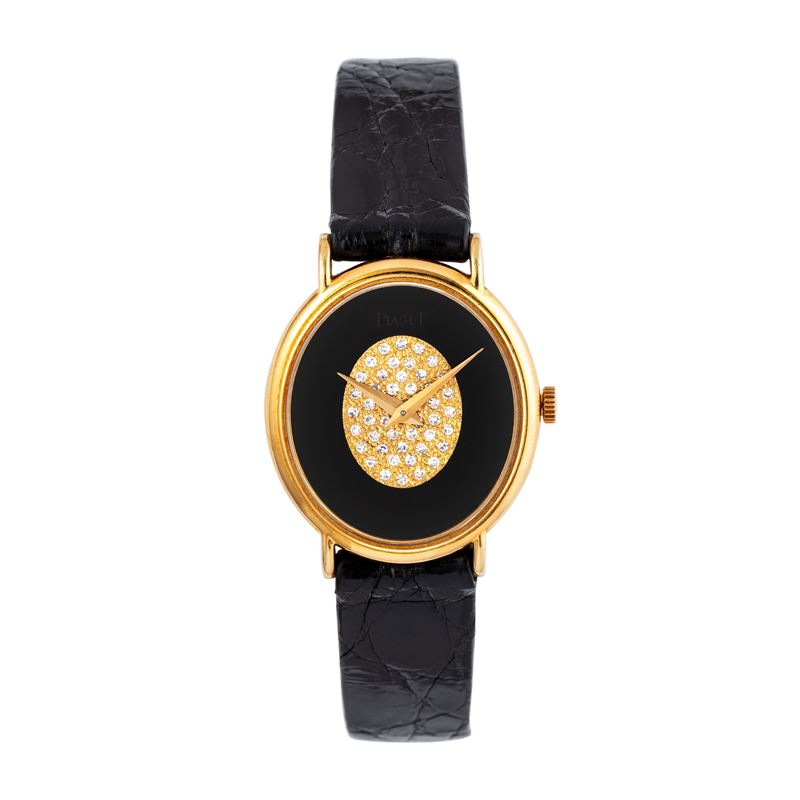 PIAGETOROLOGIO DA POLSO A CARICA MANUALE IN ORO GIALLO 18KT CON QUADRANTE IN ONICE E BRILLANTI