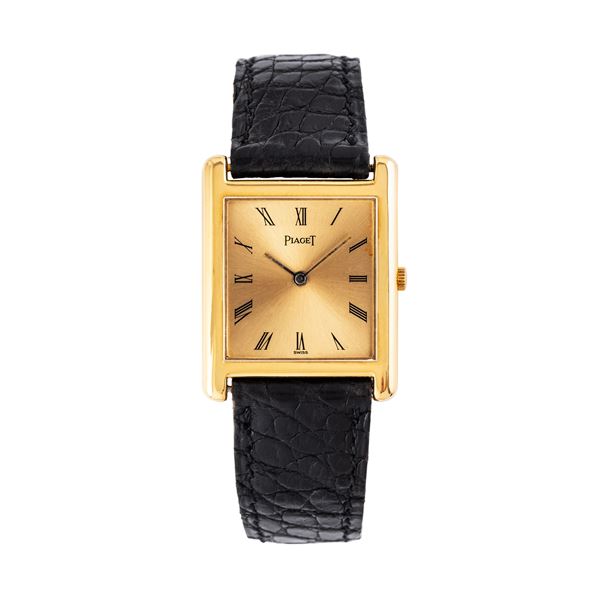 PIAGET - PIAGET - TANK MANUAL WINDING 18KT YELLOW GOLD WATCH WITH CURVED CASE AND CHAMPAGNE DIAL