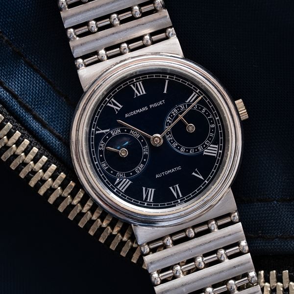 AUDEMARS PIGUET - DAY DATE PLATINUM AUTOMATIC WINDING WATCH WITH BLUE DIAL AND INTEGRATED PLATINUM BR [..]