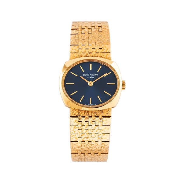 PATEK PHILIPPE - PATEK PHILIPPE - ELLIPSE MANUAL WINDING WATCH IN 18KT YELLOW GOLD WITH INTEGRATED BRACELET WORKED IN 18KT YELLOW GOLD AND BLUE SIGMA DIAL