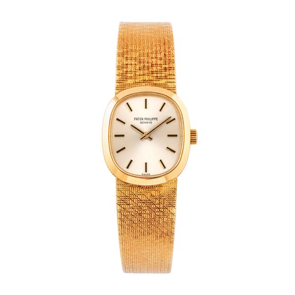 PATEK PHILIPPE - PATEK PHILIPPE - ELLIPSE 18KT YELLOW GOLD WATCH WITH MANUAL WINDING AND INTEGRATED BRACELET IN 18KT YELLOW GOLD.