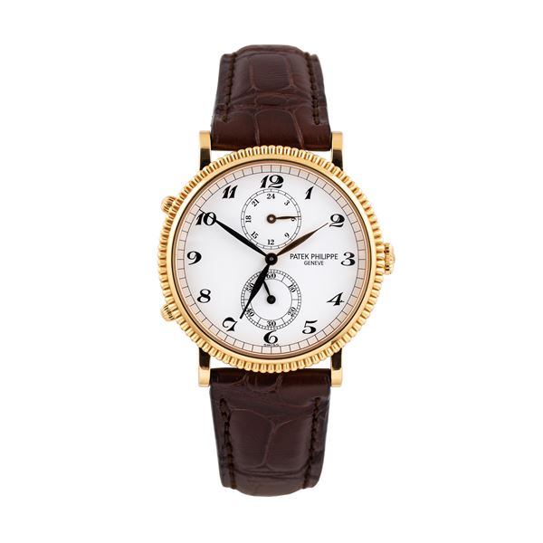 PATEK PHILIPPE - PATEK PHILIPPE - TRAVEL TIME 18KT YELLOW GOLD MANUAL WINDING WATCH WITH DOUBLE TIME, TWENTY-FOUR HOURS AND BEZEL WORKED.