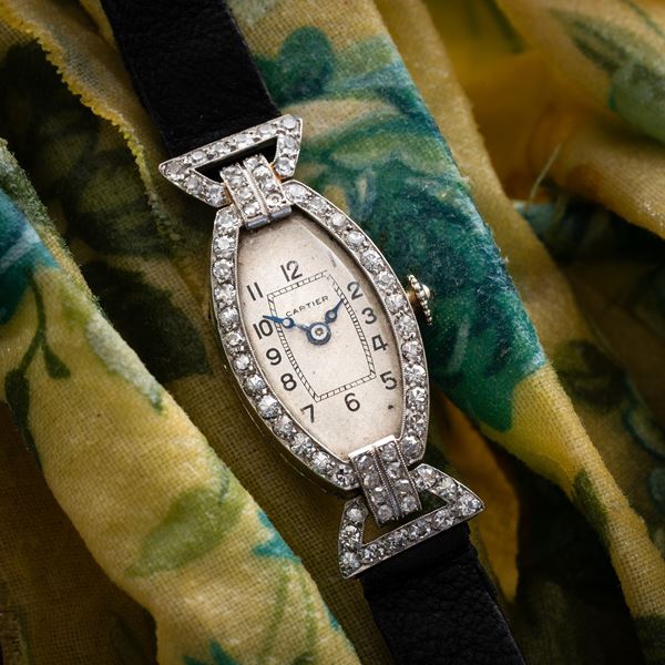 CARTIER - TONNEAU MANUAL WINDING PLATINUM WATCH WITH WHITE DIAL AND BRILLIANT-CUT DIAMOND CASE