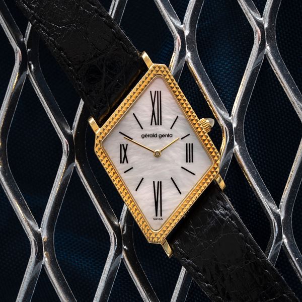 GERALD GENTA - GERALD GENTA - ASYMMETRICAL MANUAL WINDING YELLOW GOLD  WATCH WITH MOTHER-OF-PEARL DIAL AND ASYMMETRICAL 'CLOUS DE PARIS' CASE