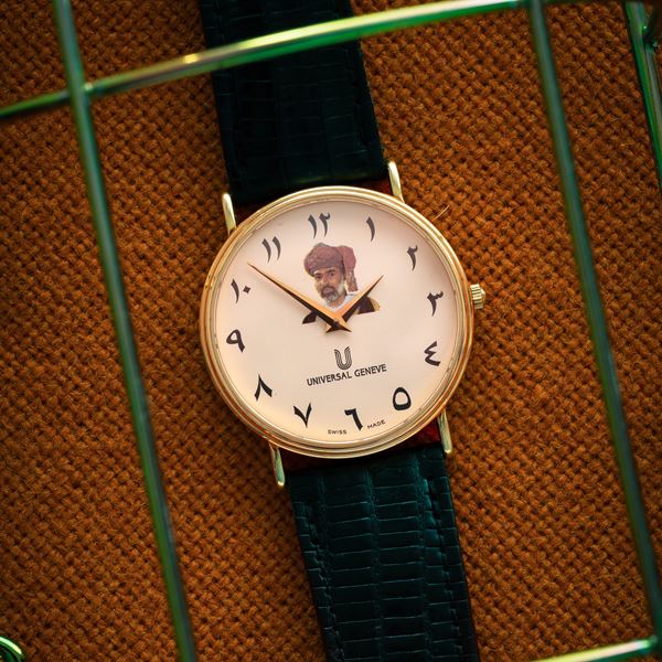 UNIVERSAL GENEVE - UNIVERSAL GENEVE - CALATRAVA QUARTZ  WATCH IN 18KT GALLO GOLD, ARABIC HOUR MARKERS AND QUABOOS SULTAN DIAL