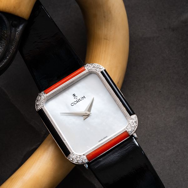 CORUM - CORUM - TANK MANUAL WINDING 18KT WHITE GOLD WATCH WITH MOTHER-OF-PEARL DIAL, BEZEL WITH ONYX, CORAL AND DIAMOND BRACELET