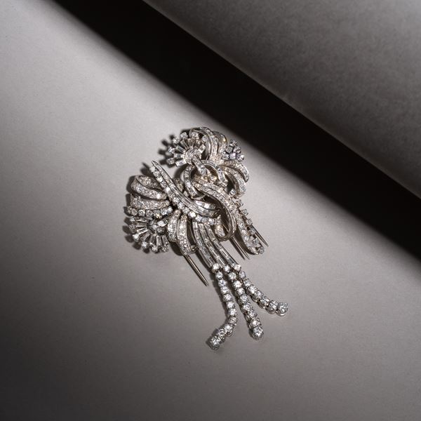 DOUBLE CLIP BROOCH IN PLATINUM AND BRILLIANT-CUT DIAMONDS AND BAGUETTES
