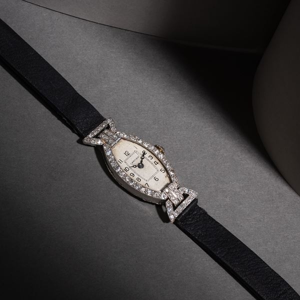 CARTIER - CARTIER - TONNEAU OROLOGIO SOLO TEMPO A CARICA MANUALE IN PLATINO CON QUADRANTE BIANCO E CASSA DIAMANTI TAGLIO BRILLANTE