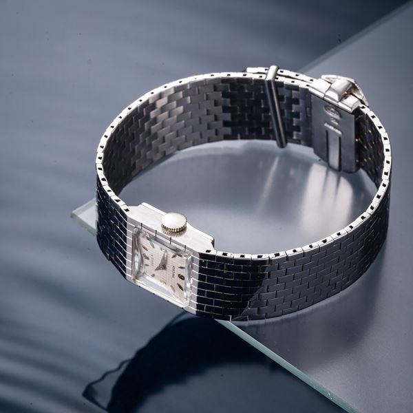 ROLEX - BELT MANUAL WINDING TIME ONLY WATCH WITH INTEGRATED 18KT WHITE GOLD BRACELET WITH WHITE “TAPISSERIE”  [..]