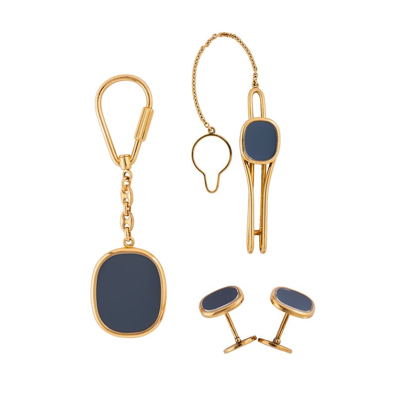 PATEK PHILIPPE - ELLIPSE SET COMPOSTO DA GEMELLI, PORTACHIAVI E FERMA CRAVATTA IN ORO GIALLO 18 K...