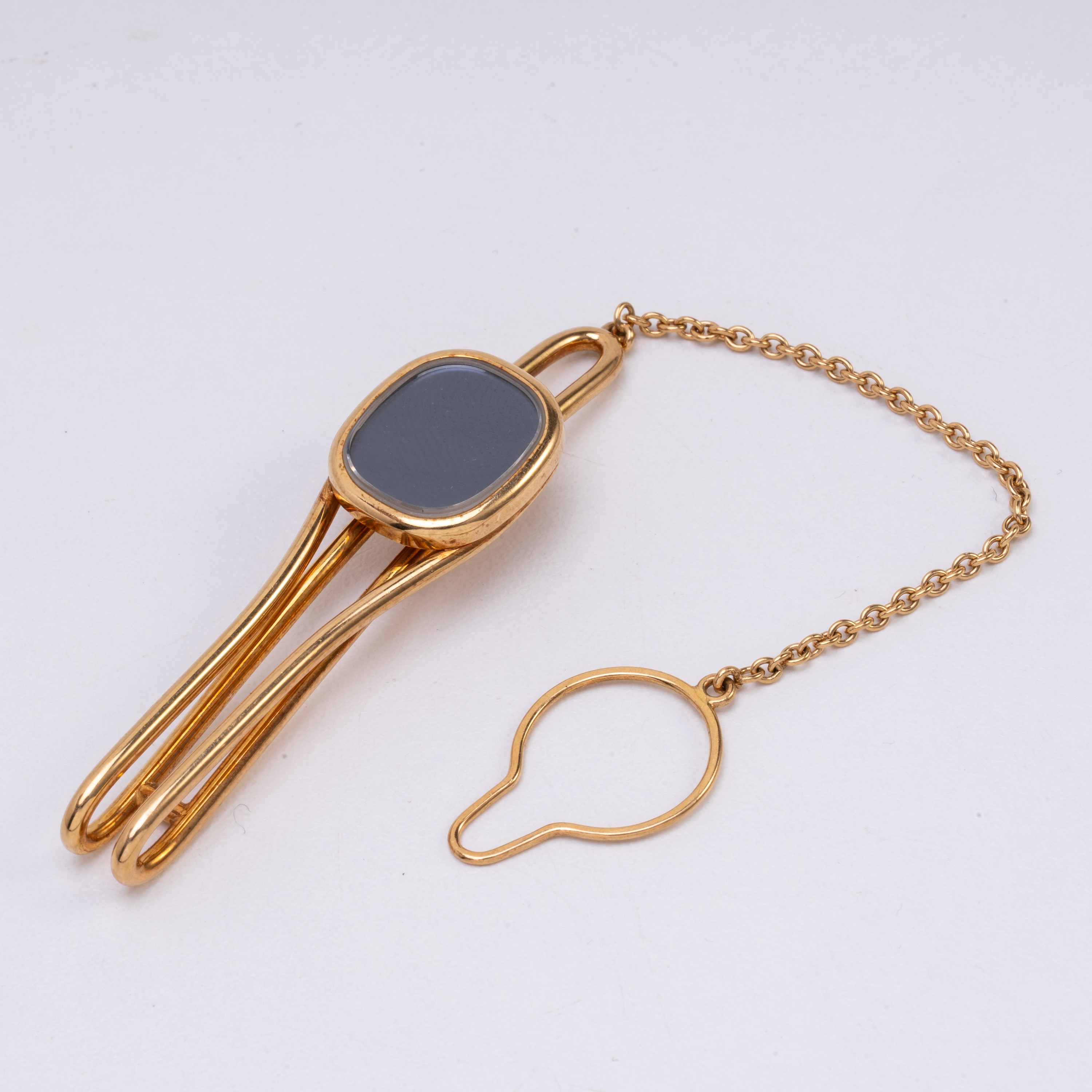 PATEK PHILIPPE - ELLIPSE SET COMPOSTO DA GEMELLI, PORTACHIAVI E FERMA CRAVATTA IN ORO GIALLO 18 K...