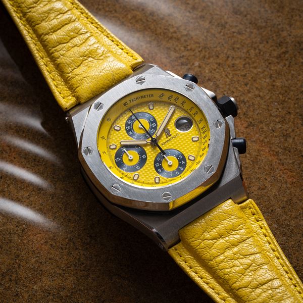 AUDEMARS PIGUET - ROYAL OAK OFFSHORE AUTOMATIC STEEL CHRONOGRAPH WITH YELLOW TAPISSERIE DIAL AND YELLOW  [..]