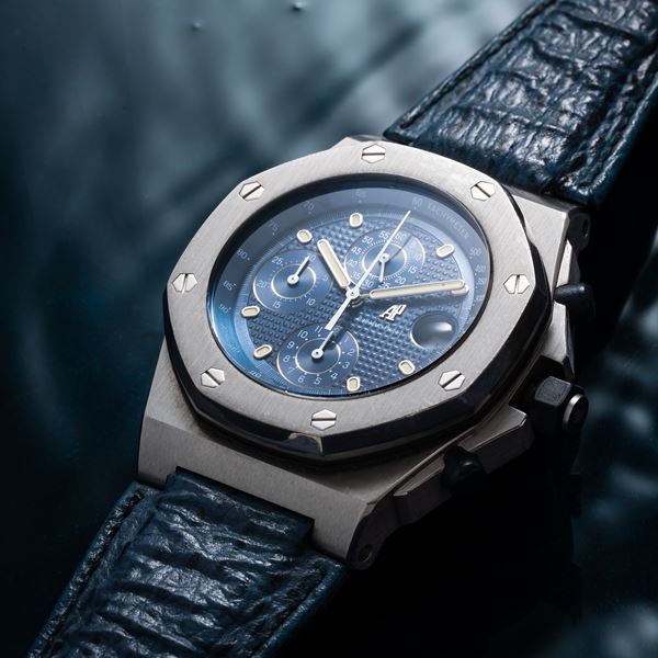 AUDEMARS PIGUET - ROYAL OAK OFFSHORE AUTOMATIC STEEL CHRONOGRAPH WITH BLUE TAPISSERIE DIAL AND BLUE  [..]