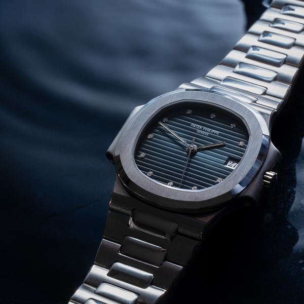 PATEK PHILIPPE - NAUTILUS AUTOMATIC STEEL TIME-ONLY WATCH WITH BLUE SIGMA DIAL AND BRILLIANT-CUT DIAMONDS  [..]