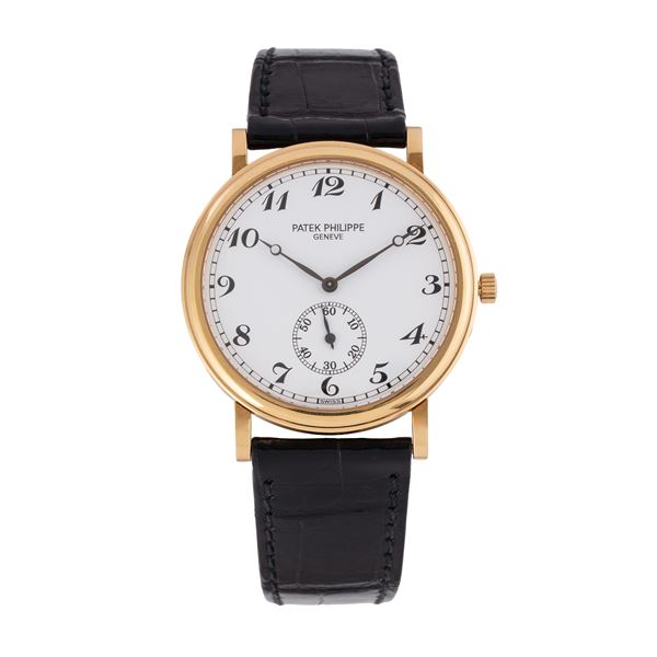 PATEK PHILIPPE - PATEK PHILIPPE - CALATRAVA 18KT YELLOW GOLD SELF-WINDING TIME-ONLY WATCH WITH STEPPED CASE, PORCELAIN DIAL WITH INDEXES AND BREGUET HANDS, SMALL SECONDS AT SIX O'CLOCK