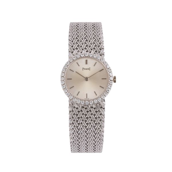 PIAGET MANUAL WINDING TIME ONLY WATCH IN 18KT WHITE GOLD WITH INTEGRATED BRACELET IN 18KT YELLOW GOLD, SILVER DIAL AND BRILLIANT-CUT DIAMOND BEZEL