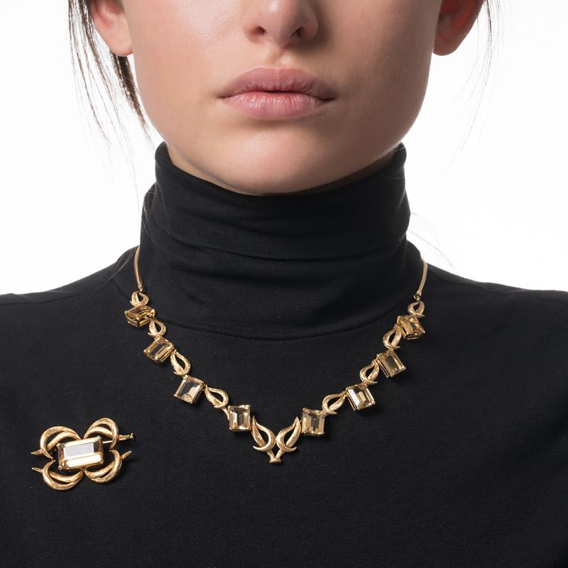 SPILLA E GIROCOLLO IN ORO GIALLO E QUARZI CITRINI