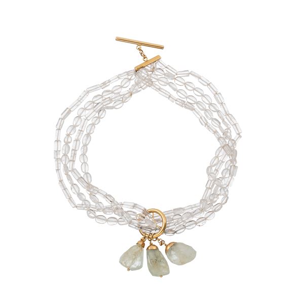 BRACCIALE IN CRISTALLO DI ROCCA E ACQUAMARINA CON CHIUSURA IN ORO GIALLO  