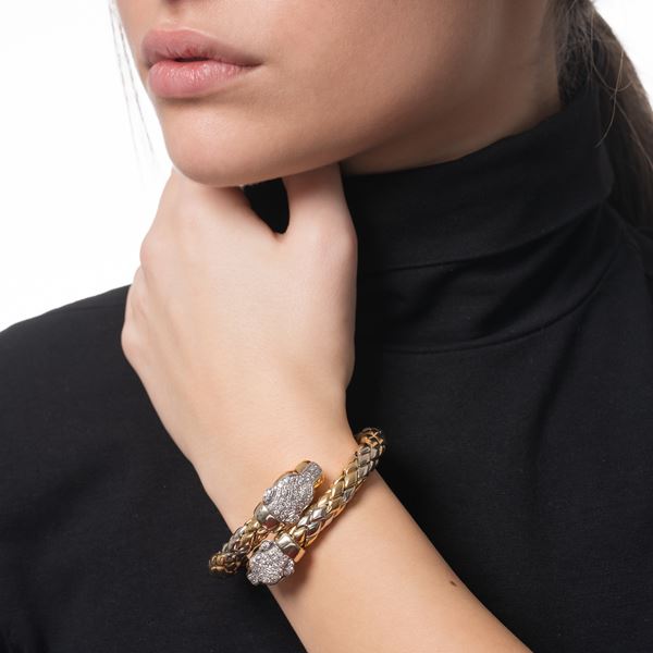 BRACCIALE IN ORO GIALLO E BIANCO CON DIAMANTI TAGLIO BRILLANTE
