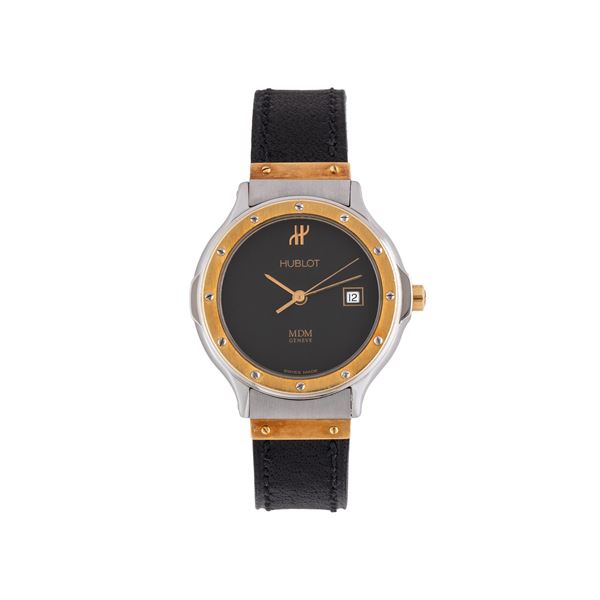 HUBLOT - HUBLOT - MDM OROLOGIO SOLO TEMPO AL QUARZO INACCIAIO E ORO GIALLO 18 KT CON QUADRANTE NERO, SECONDI CENTRALI E DATARIO AD ORE TRE.