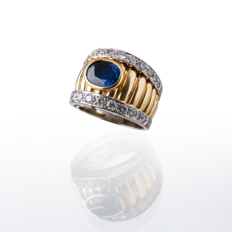 ANELLO IN ORO GIALLO E BIANCO 18 KT CON ZAFFIRO INTENSE BLUE