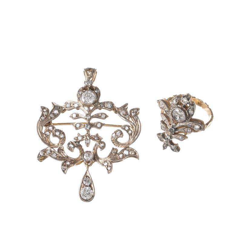 PAROURE, SPILLA E ANELLO IN ORO GIALLO 18 KT CON CONTORNO DI DIAMANTI