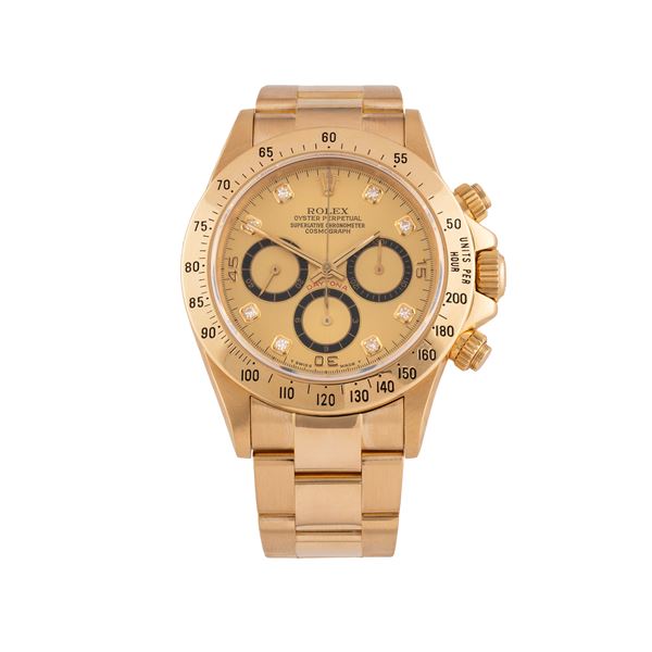ROLEX - ROLEX - DAYTONA  CRONORAFO A CARICA AUTOMATICA IN ORO GIALLO 18 KT CON QUADRANTE CHAMPAGNE CON INDICI DIAMANTI E BRACCIALE IN ORO GIALLO 18 KT