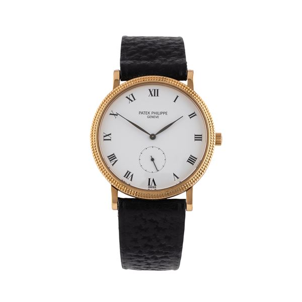 PATEK PHILIPPE - PATEK PHILIPPE - CALATRAVA OROLOGIO SOLO TEMPO A CARICA MANUALE IN ORO GIALLO 18 KT CON GHIERA 'CLOUS DE PARIS', QUADRANTE BIANCO PORCELLANA E INDICI ROMANI NERI